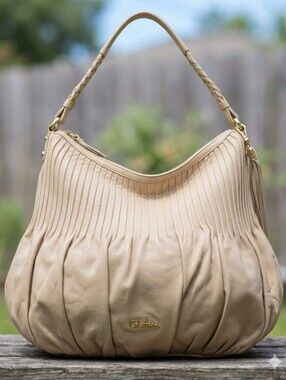 Cole Haan Beige Pleated Leather Hobo with Tassel and Gold Accents With Tassel